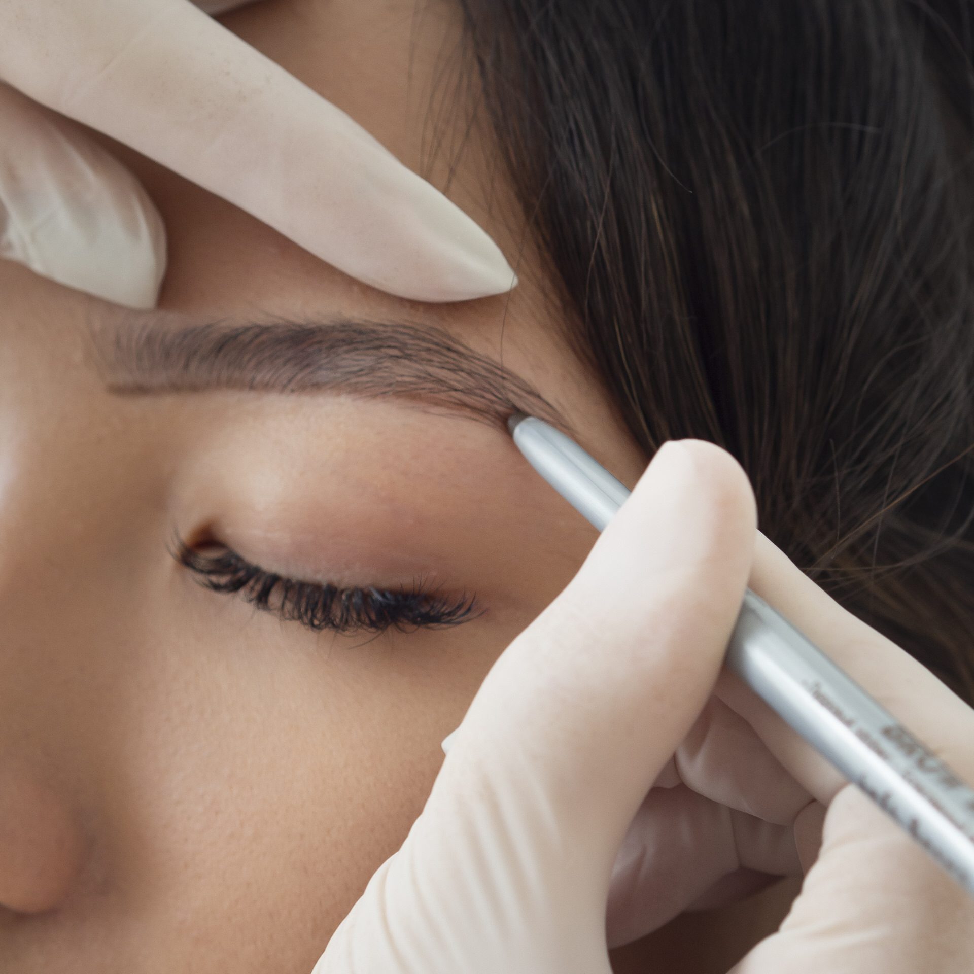 beautician-doing-microblading-treatment-client-s-eyebrows